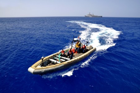 US Navy 110414-N-7293M-608 Sailors assigned to the amphibious transport dock ship USS Ponce (LPD 15) transit to the guided-missile destroyer USS Ba