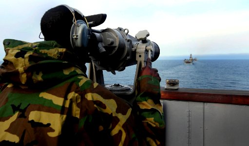 US Navy 110409-N-OS570-137 Seaman Sualllah Osman stands port wing watch during a simulated straights transit exercise aboard the San Antonio-class
