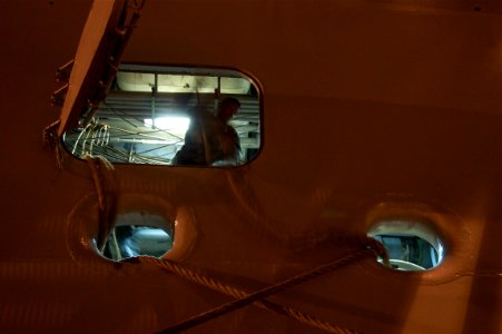 US Navy 110413-N-ZC343-444 A Sailor handles mooring lines after USS Bonhomme Richard (LHD 6) moved from NASSCO dry dock to Naval Base San Diego