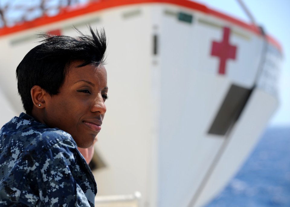US Navy 110412-N-NY820-006 Mass Communication Specialist 1st Class Kim Williams enjoys views of distant Haiti aboard USNS Comfort (T-AH 20) during