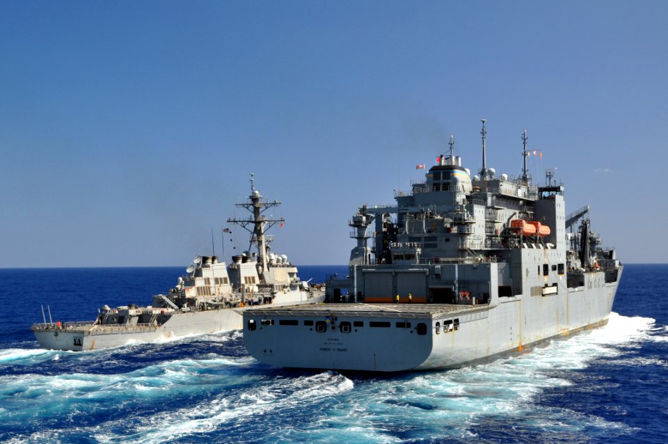 US Navy 110415-N-7293M-189 The Arleigh Burke-class guided-missile destroyer USS Barry (DDG 52), left, conducts an underway replenishment with the M