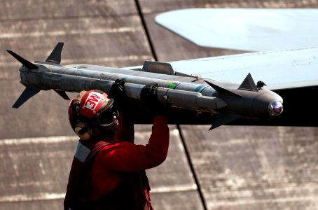 US Navy 110412-N-6505H-052 Aviation Ordnanceman 3rd Class Kwadjo Ofosu, assigned to Strike Fighter Squadron (VFA) 113, checks an AIM-9 Sidewinder o