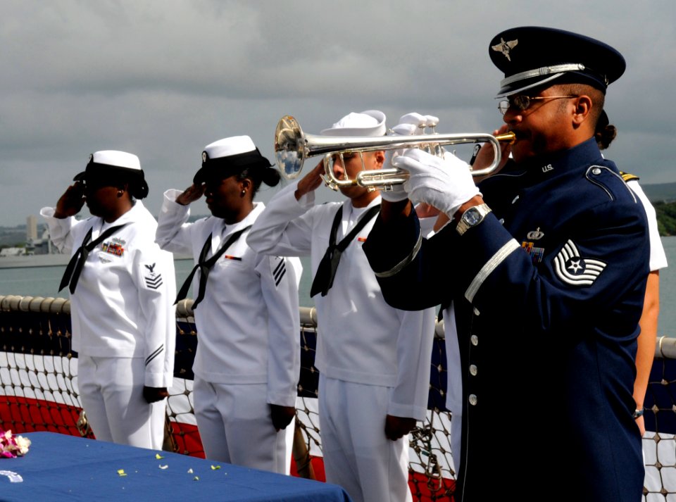 US Navy 110414-N-VM928-101 A U.S. Air Force bugler plays Taps during a remembrance ceremony for USS Sigsbee (DD 502) aboard SS Chung-Hoon (DDG 93)