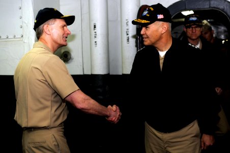 US Navy 110414-N-OY799-070 Rear Adm. Joseph Aucoin, left, commander of Carrier Strike Group 3, greets Vice Adm. Richard Hunt, commander of the U.S