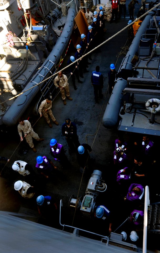 US Navy 110413-N-OS574-059 Sailors heave lines on the boat deck aboard the San Antonio-class amphibious transport dock ship USS Mesa Verde (LPD 19)