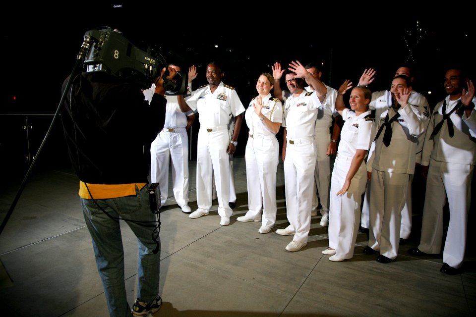 US Navy 110413-N-YM440-007 Sailors participating in Dallas-Fort Worth Navy Week wave to the camera before a Daybreak morning news show segment on W