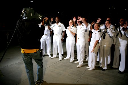 US Navy 110413-N-YM440-007 Sailors participating in Dallas-Fort Worth Navy Week wave to the camera before a Daybreak morning news show segment on W