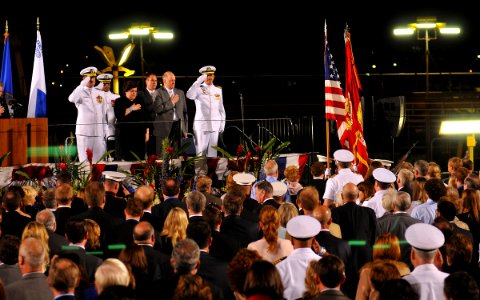 US Navy 110416-N-DX615-016 Distinguished guests attending the christening ceremony for USNS William McLean (T-AKE 12) render honors as the Marine C