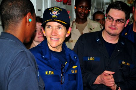 US Navy 110413-N-ZS026-224 Rear Adm. Margaret Klein alks with Machinist's Mate 1st Class Eric Freemen in the main machinery space of USS Boxer (LHD