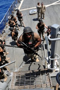 US Navy 110414-N-7293M-296 Aviation Ordnanceman Airman Albert Frank, assigned to the visit board, search and seizure (VBSS) team from the amphibiou