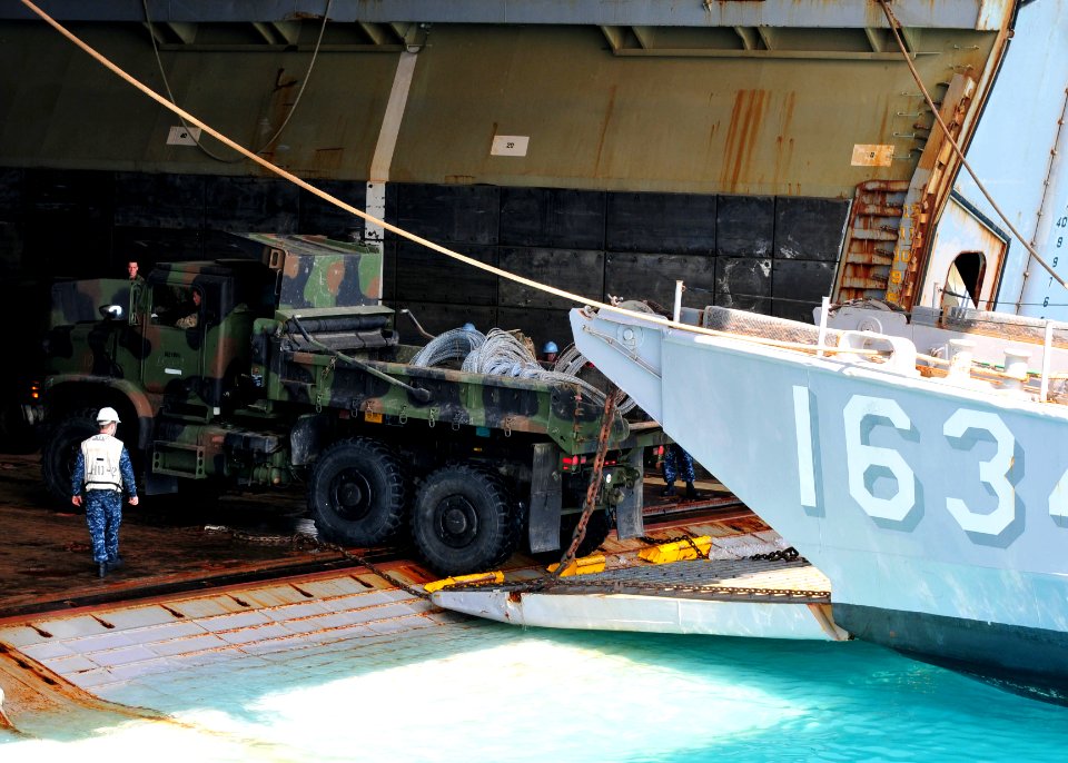US Navy 110412-N-5538K-569 A 31st Marine Expeditionary Unit (31st MEU) seven-ton truck embarks a landing craft utility from the well deck of the fo