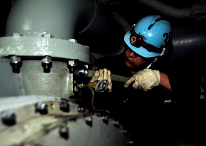 US Navy 110416-N-VL413-065 A Japanese shipyard worker aboard the nuclear powered aircraft carrier USS George Washington (CVN 73) performs preservat