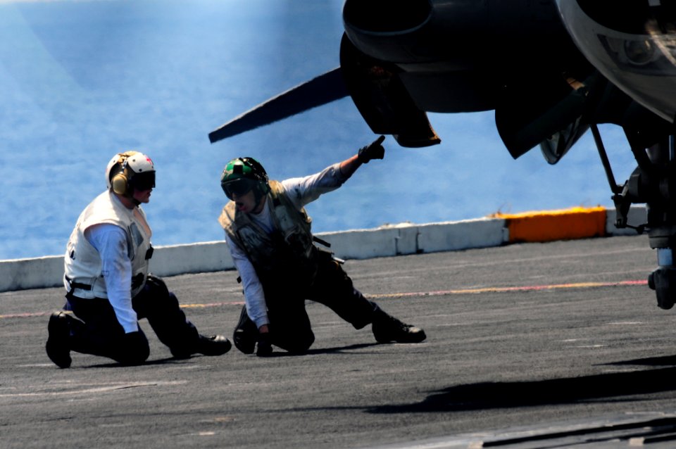 US Navy 110413-N-UO379-028 Sailors conduct a pre-flight inspection of an E-2C Hawkeye assigned to the Black Eagles of Airborne Early Warning Squadr