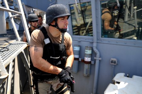 US Navy 110414-N-7293M-496 Boatswain's Mate Seaman Michael, assigned to the visit board, search and seizure (VBSS) team from the amphibious transpo