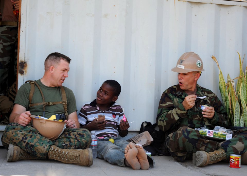 US Navy 110417-N-NY820-402 Sgt. Peter Swigart, left, from Maumee, Ohio, and Construction Mechanic 1st Class Allan Broussard, from Beaumont, Texas,