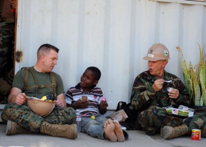US Navy 110417-N-NY820-402 Sgt. Peter Swigart, left, from Maumee, Ohio, and Construction Mechanic 1st Class Allan Broussard, from Beaumont, Texas,