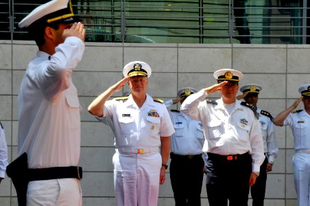 US Navy 110412-N-ZB612-024 Chief of Naval Operations (CNO) Adm. Gary Roughead renders honors at a welcoming ceremony during his visit to meet with