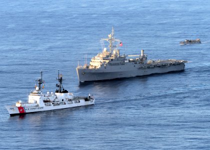 US Navy 110413-F-HS649-046 The U.S. Coast Guard cutter Jarvis (WHEC-725), front, the amphibious transport dock ship USS Cleveland (LPD 7) and Landi