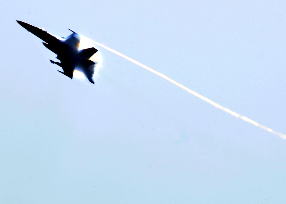 US Navy 110416-N-DM338-334 An F-A-18C Hornet speeds off after making an attack run on a simulated target in the wake of USS Ronald Reagan (CVN 76)