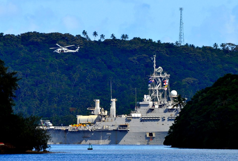 US Navy 110413-N-KB563-207 An MH-60S Sea Hawk helicopter flies over the amphibious transport dock ship USS Cleveland (LPD 7) during flight operatio