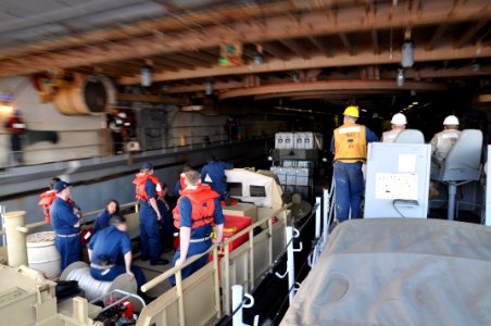 US Navy 110415-N-7293M-488 Landing Craft Utility (LCU) 1661 maneuvers into the well deck of the amphibious transport dock ship USS Ponce (LPD 15)