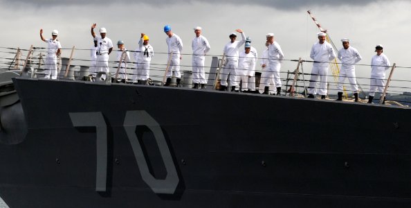 US Navy 110415-N-VM928-037 Sailors man the rails aboard the guided-missile destroyer USS Hopper (DDG 70) as the ship departs Joint Base Pearl Harbo photo