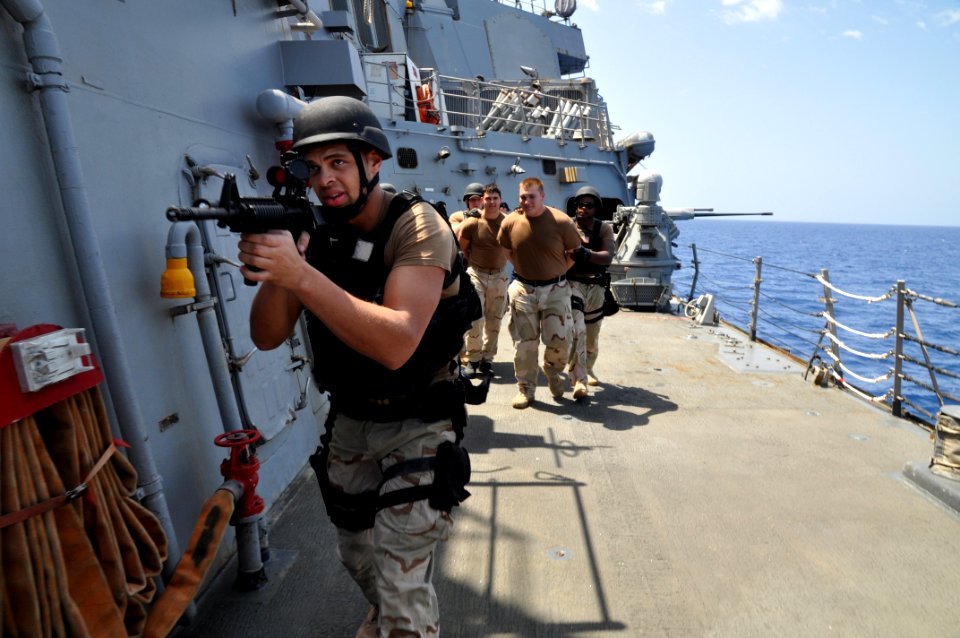 US Navy 110414-N-7293M-413 Operations Specialist 3rd Class David Wolery, assigned to the visit board, search and seizure (VBSS) team from the amphi