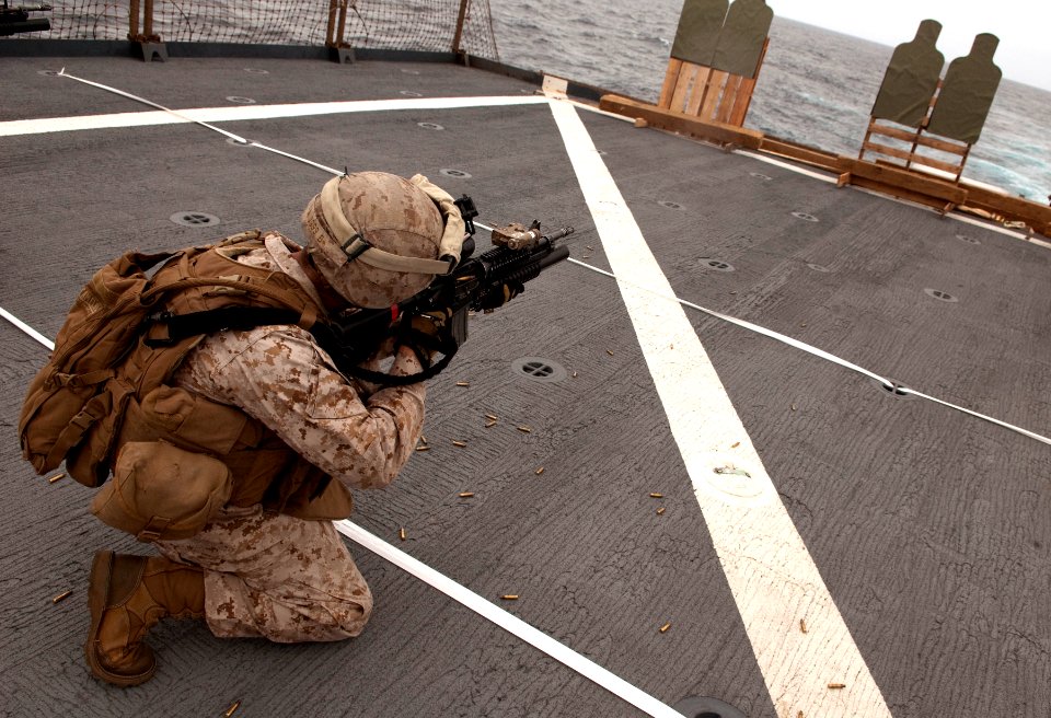US Navy 110418-N-QP268-404 A Marine assigned to E Company the 22nd Marine Expeditionary Unit (22nd MEU), E Company fires at his target during a liv