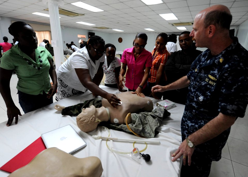 US Navy 110418-N-QD416-072 Capt. David Tanen explains needle decompression to emergency medical technicians and members of the Jamaican Ministry of