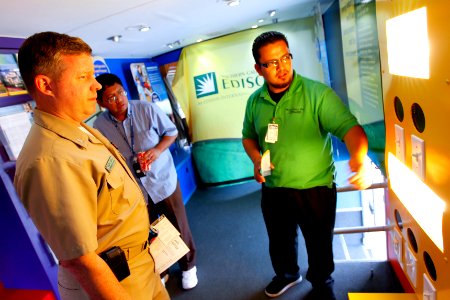 US Navy 110419-N-HW977-301 Cmdr. Jon Jerge views an energy-efficient lighting display inside Southern California Edison's Mobile Energy Unit with E