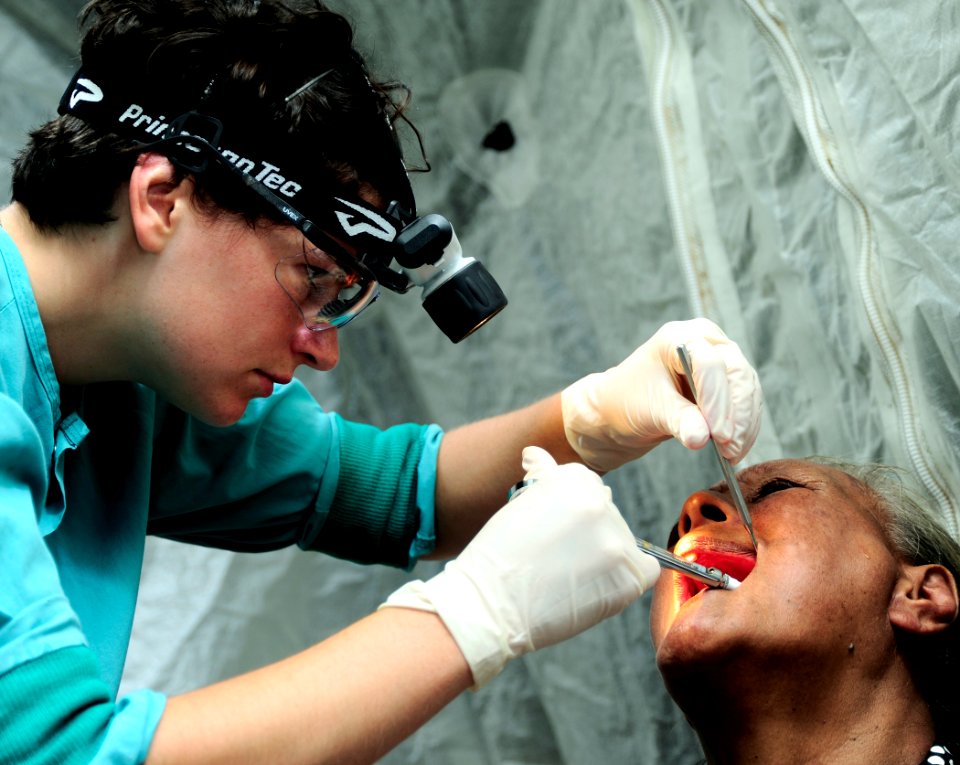 US Navy 110416-F-HS649-112 Royal Australian navy dentist Lt. Shannon Godfrey uses anesthesia on a Tongan woman before extracting a tooth during Pac
