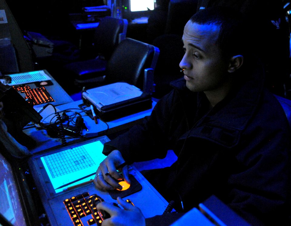 US Navy 110420-N-0074G-010 Air Traffic Controller Airman Steven J. Doyel monitors the position of air contacts in the air traffic control center ab