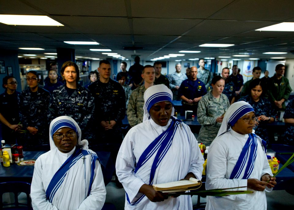 US Navy 110417-N-RM525-264 Sisters from the Missionaries of Charity of Jamaica sing hymns from the Bible during afternoon church services on Palm S