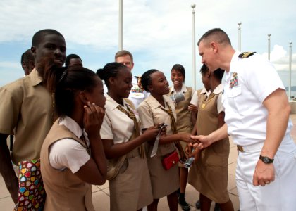 US Navy 110421-N-NY820-240 The Military Sealift Command hospital ship USNS Comfort (T-AH 20) Chaplain Cmdr.Raymond Houk greets Trenchtown Primary S