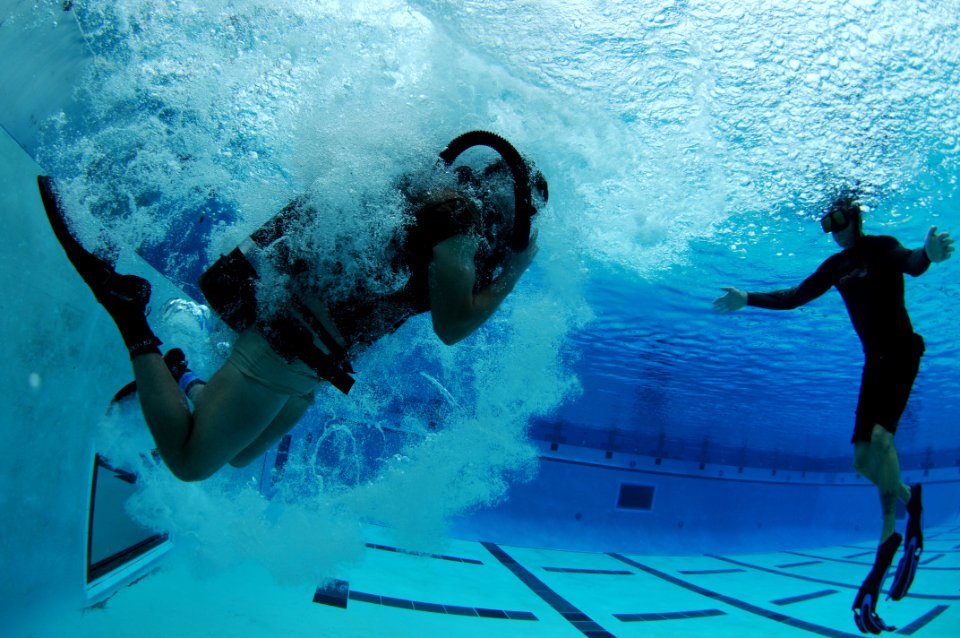 US Navy 110420-N-JR159-139 Students from Basic Underwater Demolition-SEAL (BUD-s) Class 287 participate in night gear exchange during the second ph photo