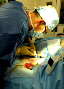 US Navy 110420-N-UB993-105 Capt. Craig Salt, a plastic surgeon assigned to Naval Medical Center San Diego, performs a skin graft as part of the Pro