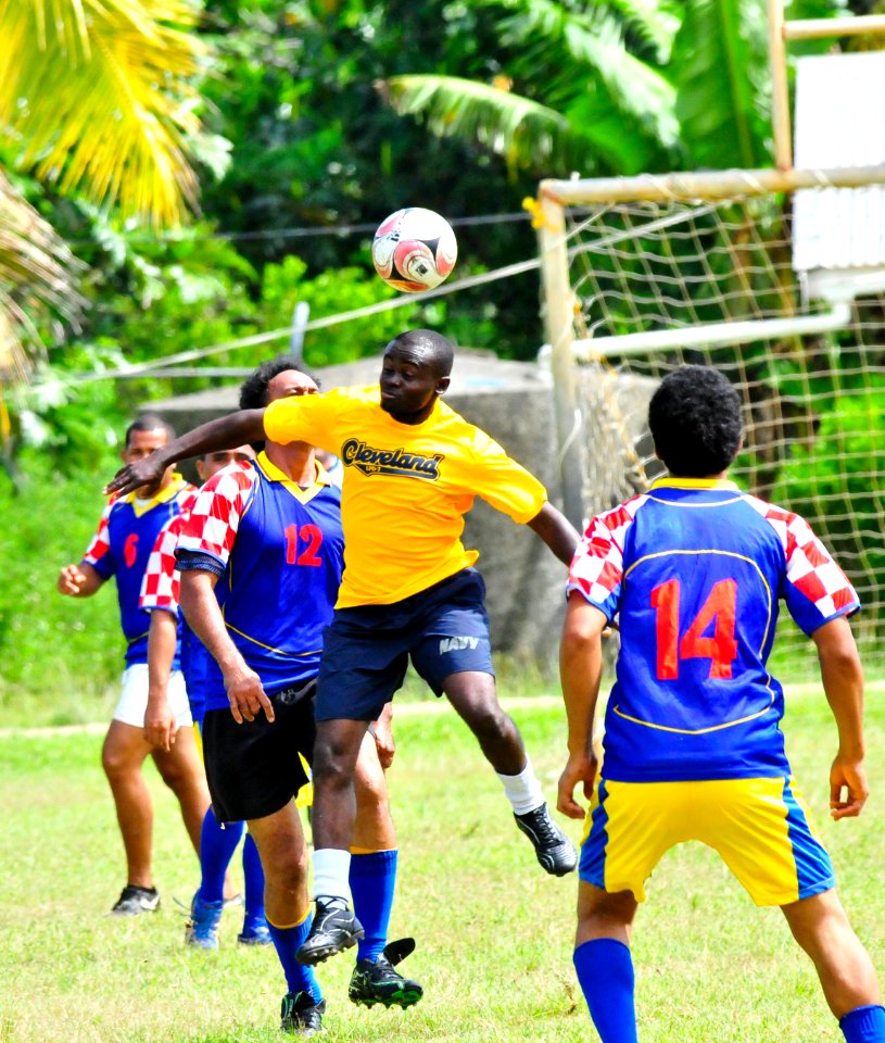 US Navy 110420-O-XX000-002 Seaman Jones Kwaobaffour plays soccer against a Tongan team during a Pacific Partnership 2011 community service event