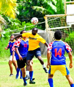 US Navy 110420-O-XX000-002 Seaman Jones Kwaobaffour plays soccer against a Tongan team during a Pacific Partnership 2011 community service event