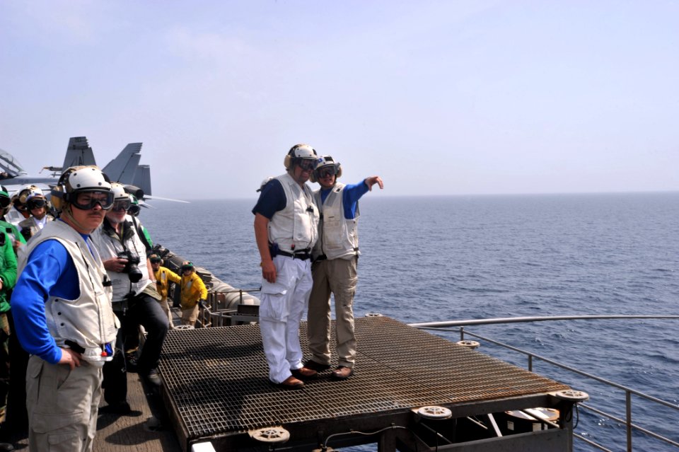 US Navy 110423-N-0569K-005 Country music performer Toby Keith tours the flight deck with Capt. Gregory L. Huffman, executive officer of the aircraf