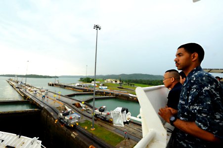US Navy 110426-F-CF975-042 Sailsors watch as a lock fills with water as the Military Sealift Command hospital ship USNS Comfort (T-AH 20)