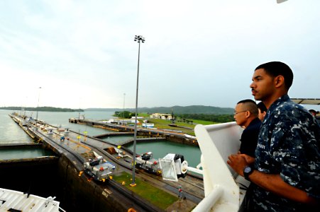 US Navy 110426-F-CF975-042 Sailsors watch as a lock fills with water as the Military Sealift Command hospital ship USNS Comfort (T-AH 20) photo