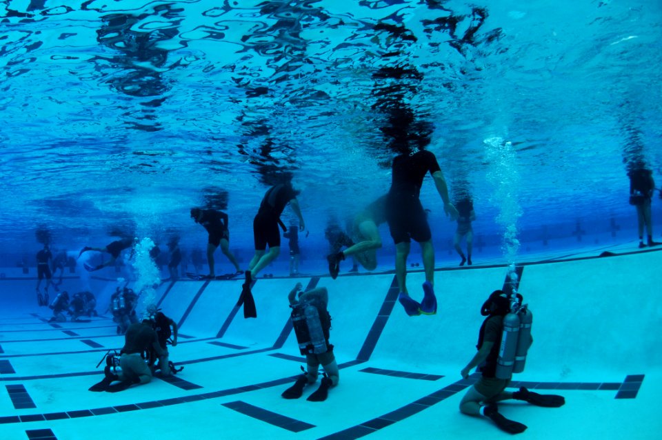 US Navy 110420-N-JR159-300 Students from Basic Underwater Demolition-SEAL (BUD-s) Class 287 participate in night gear exchange during the second ph photo