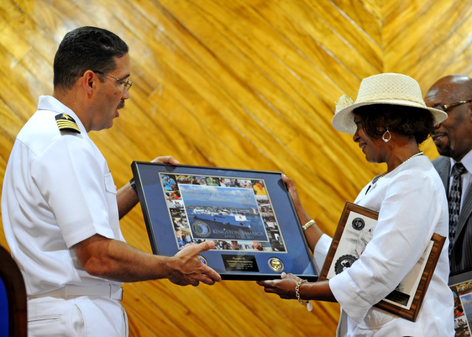 US Navy 110421-N-NY820-170 Commodore Brian Nickerson, mission commander of Continuing Promise 2011, exchanges gifts with U.S. Ambassador Pamela Bri