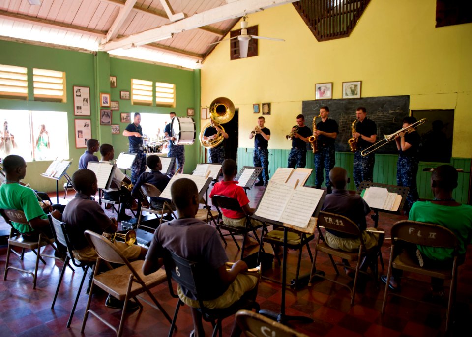 US Navy 110420-N-RM525-139 The U.S. Fleet Forces Band plays a song for the Alpha Boys School concert band during a Continuing Promise 2011 subject