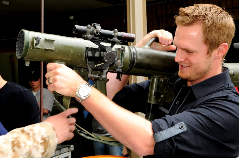 US Navy 110421-N-JR159-030 Major league baseball player Kyle Kendrick, of the Philadelphia Phillies, holds a Carl Gustav rocket launcher during a t