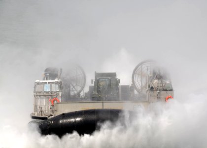 US Navy 110422-N-7680E-184 A landing craft air cushion (LCAC) approaches the multi-purpose amphibious assault ship USS Iwo Jima (LHD 7)
