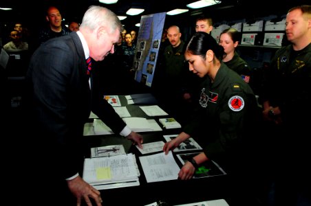US Navy 110420-N-UO379-208 Ensign Chantel Fabionar briefs Secretary of the Navy (SECNAV) the Honorable Ray Mabus on the role of the aircraft carrie