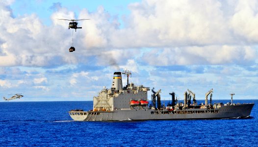 US Navy 110426-O-ZZ999-005 An MH-60S Sea Hawk helicopter assigned to the Wild Cards of Helicopter Sea Combat Squadron (HSC) 23 transports supplies