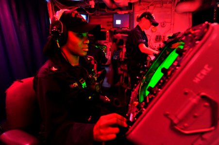 US Navy 110426-N-0569K-012 Operations Specialist 3rd Class Lakysha C. Brown operates the SPA-25G console to track surface contacts aboard the aircr