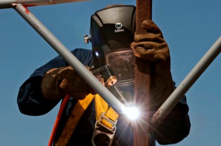 US Navy 110427-N-RC734-037 Hull Maintenance Technician 3rd Class Christian Staldt repairs an awning support structure aboard the amphibious dock la